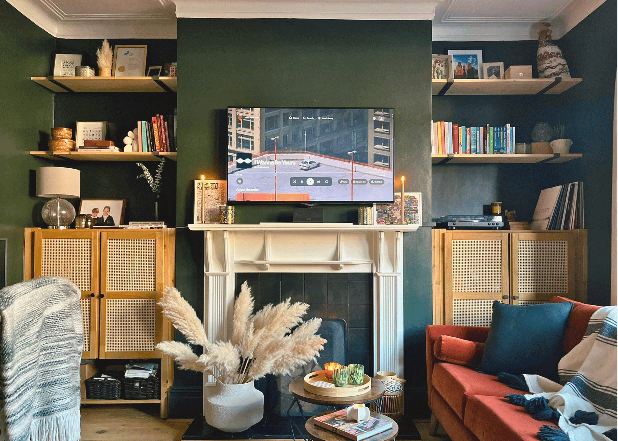 cover Image of a transformed living room into a multi-functional home office with dark green walls and a workspace