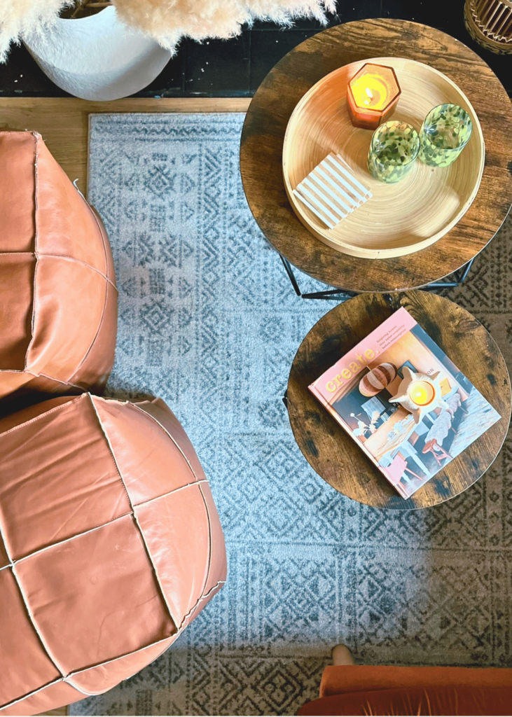 final image of the space in relaxation living room mode with candles and books