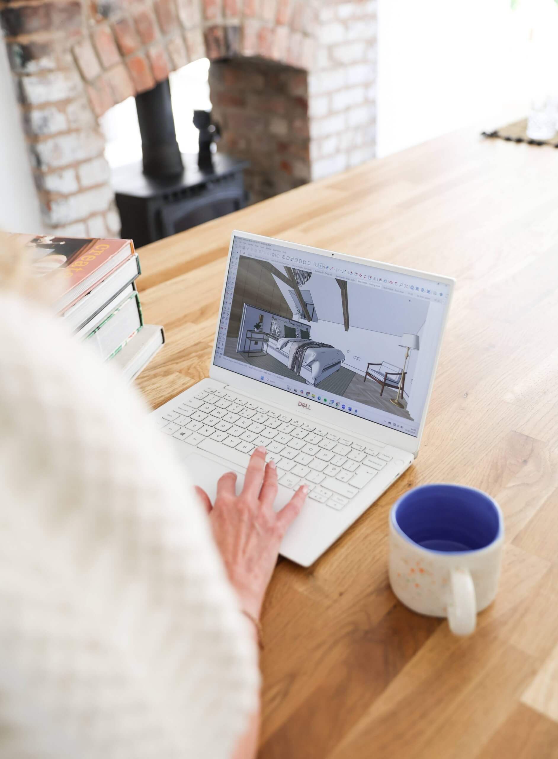 Interior designer Kelly in Manchester studio -working on client CAD drawings. Spaces by Kelly